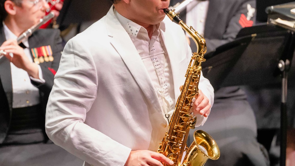 Kenneth Tse perfroming saxophone with the US Navy Band