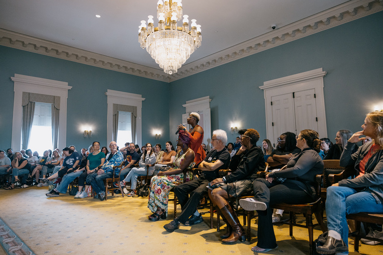 Audience members ask questions during Josh Johnson's talk in the Old Capitol Senate Chamber