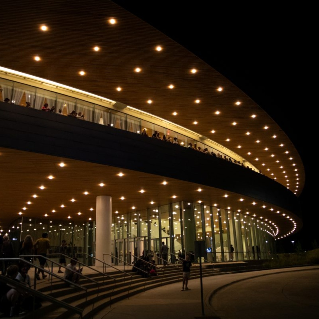 Community members enter Hancher Auditorium at the University of Iowa